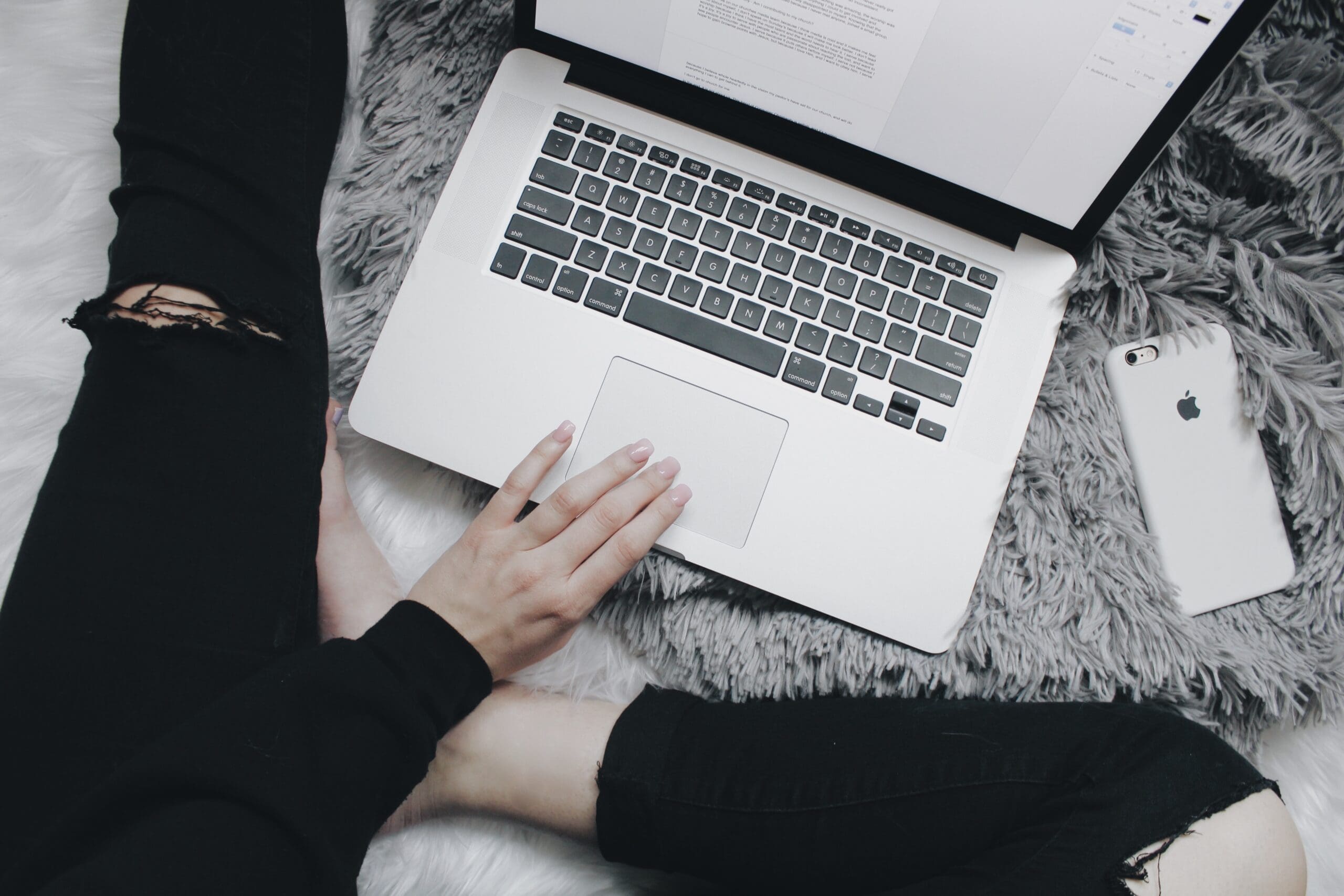 stock image of woman on computer typing