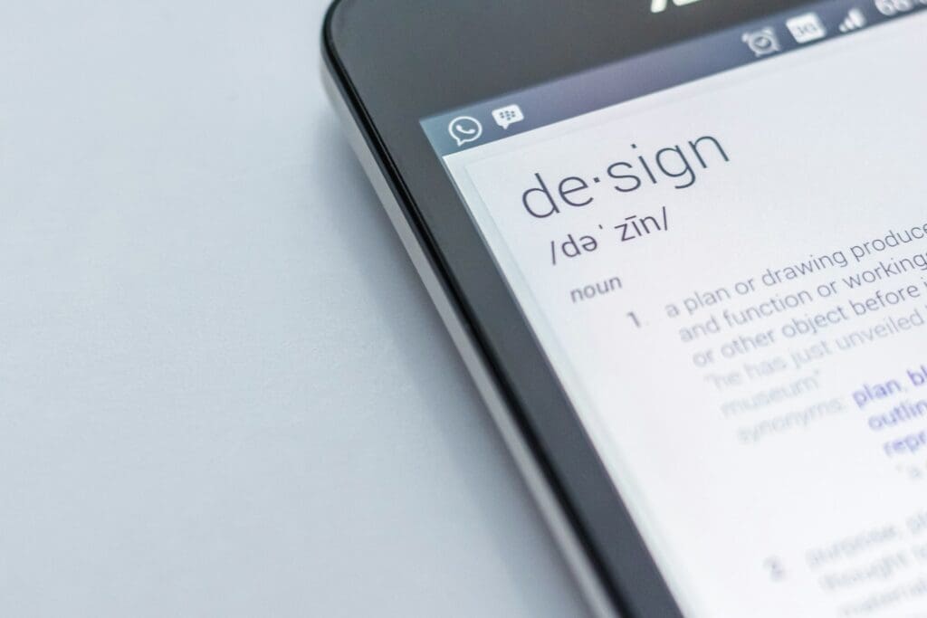 close up image of phone searching the definition of design.